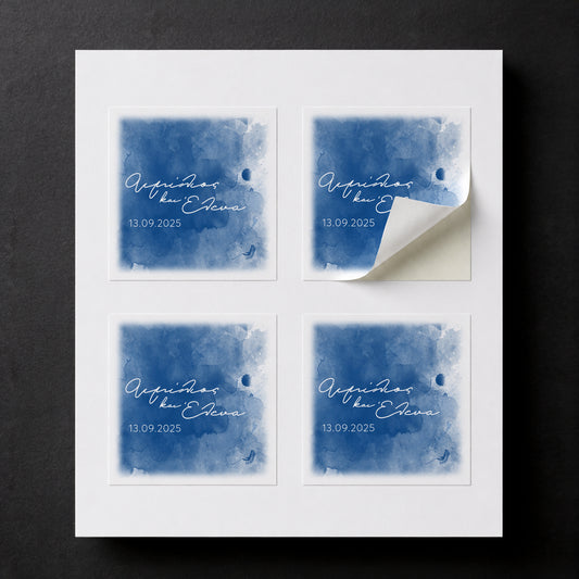 Sheet with four printed Blue Romance wedding favor stickers for white paper cube favor boxes.