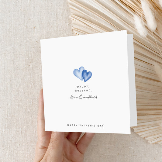 Minimal Father's Day greeting card with blue watercolor hearts and Daddy Husband Our Everything message