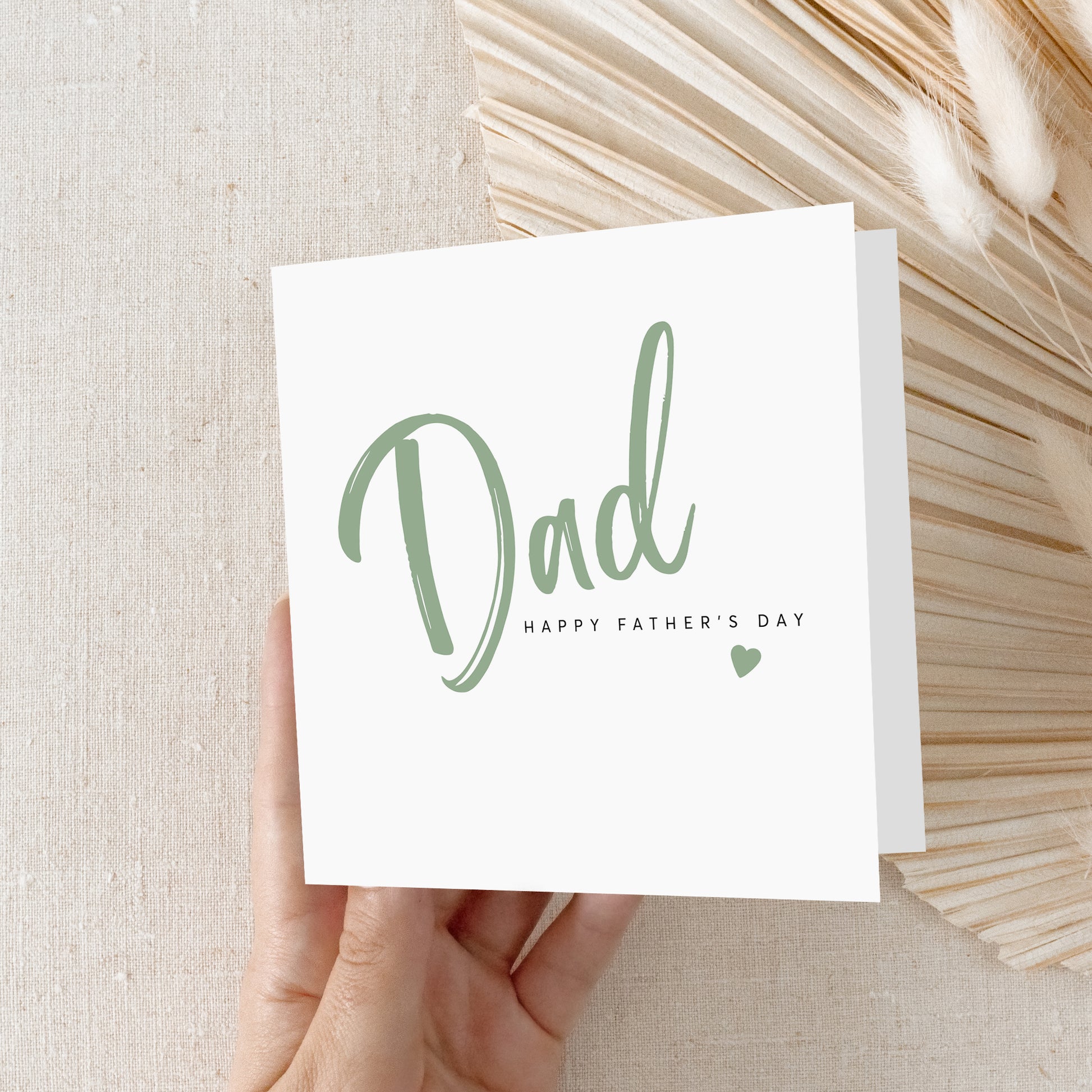 Minimal Father's Day greeting card with sage green Dad typography and kraft  envelope