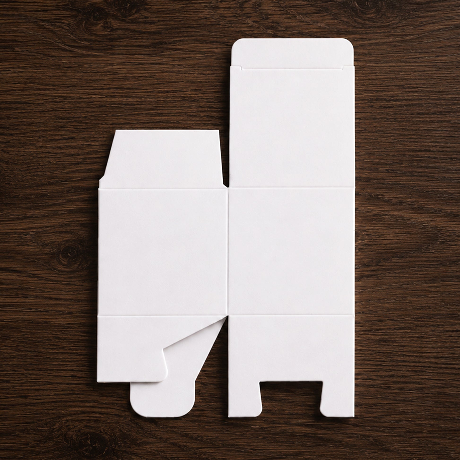Flat white paper cube favor box before assembly, made from thick 400 gsm paper.
