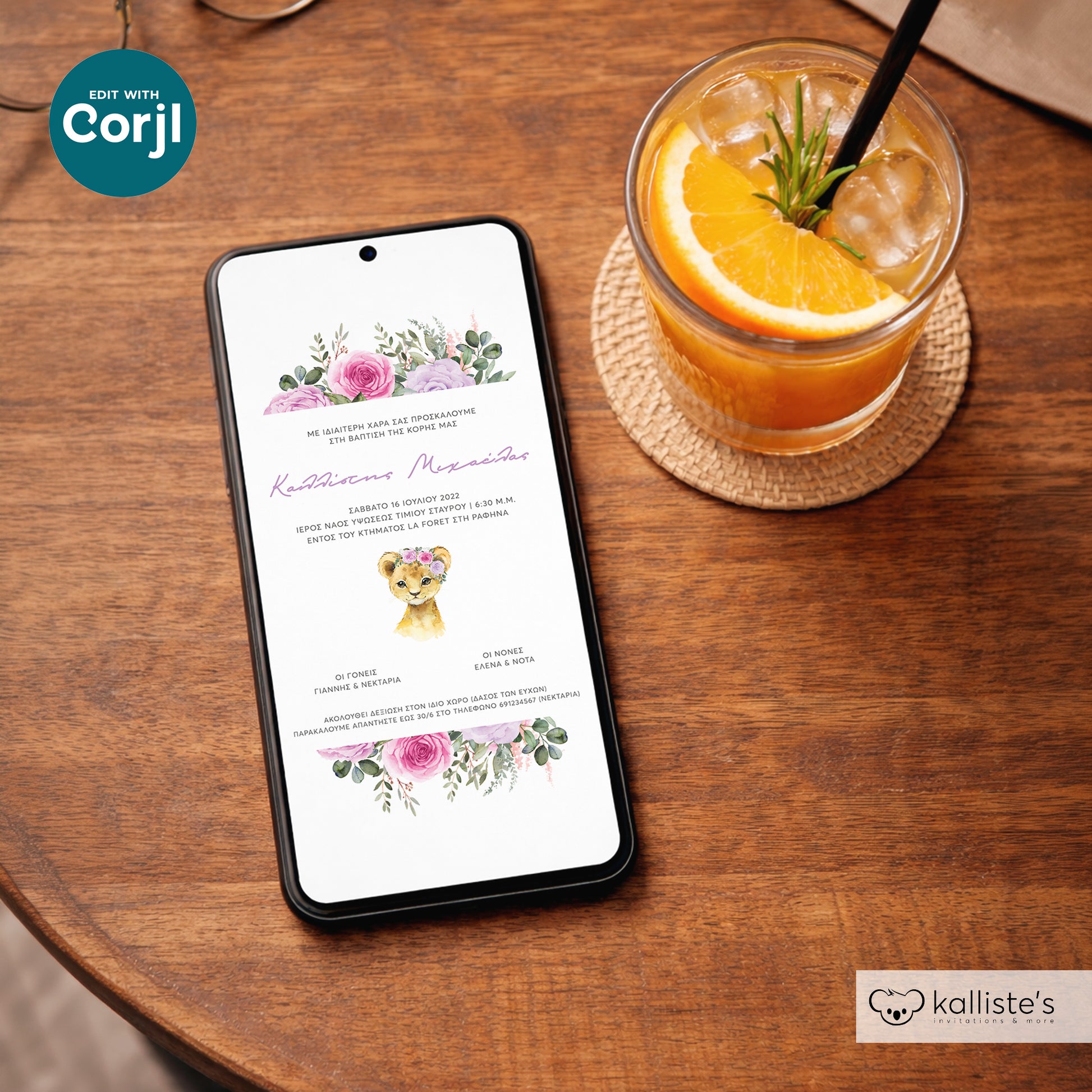 Phone displaying a wedding invitation on a wooden table with a drink