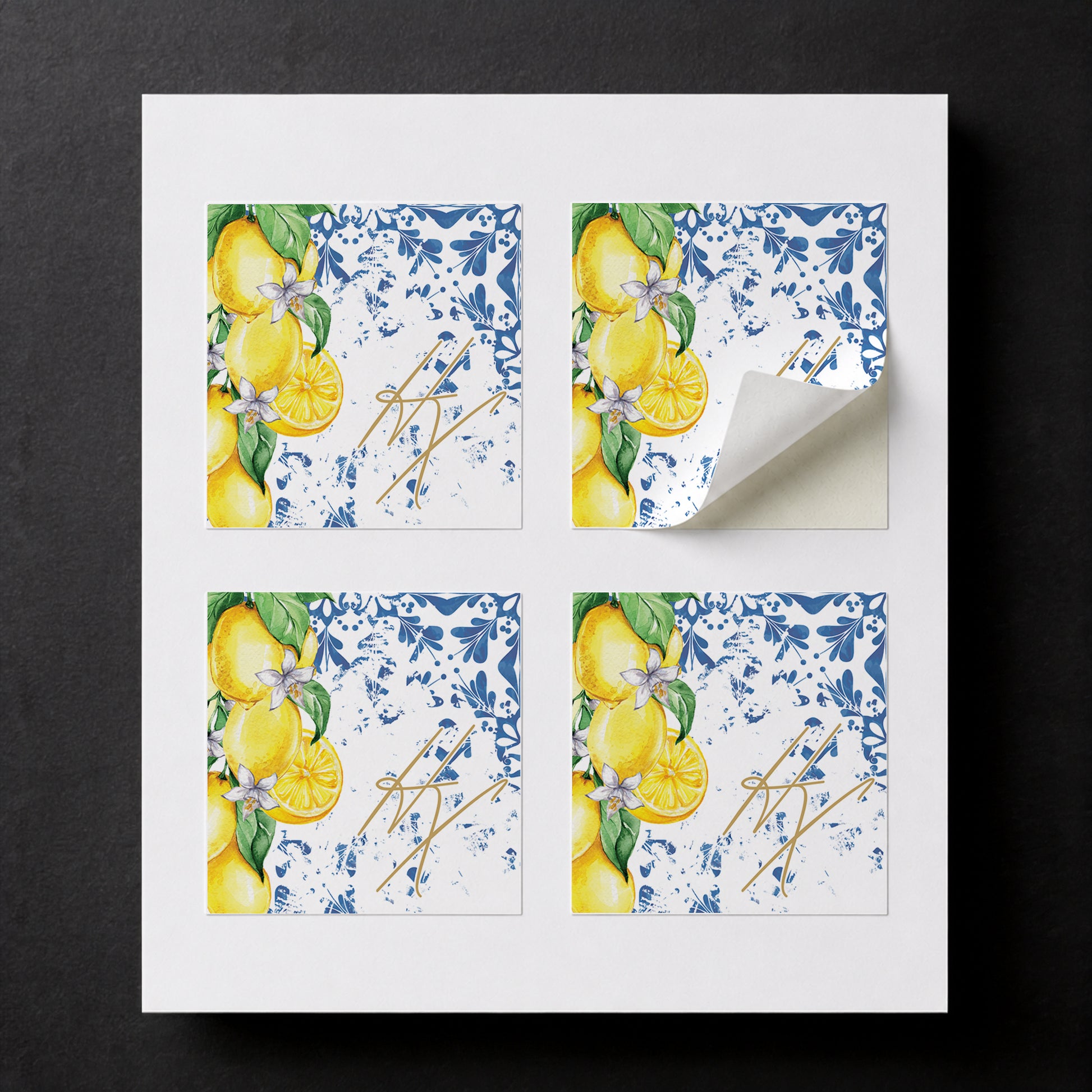 Sheet with four printed Mediterranean Lemons wedding favor stickers for white paper cube favor boxes.
