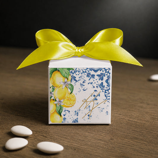White paper cube favor box 7.5 × 7.5 × 7.5 cm, made from thick 400 gsm paper with printed sticker and ribbon in your choice of color – elegant wedding favor box. Theme: Mediterranean Lemons.
