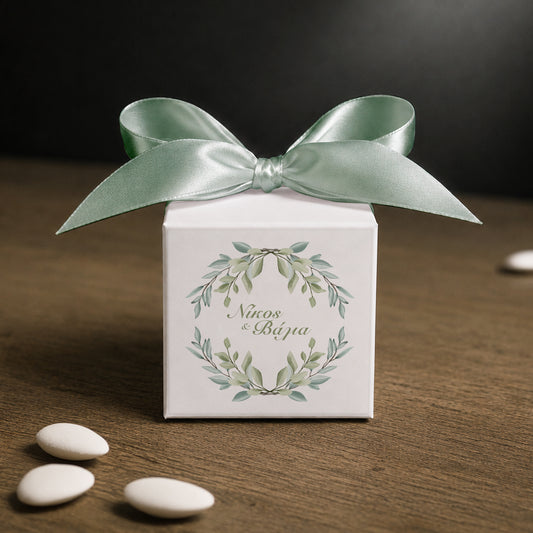 White paper cube favor box 7.5 × 7.5 × 7.5 cm, made from thick 400 gsm paper with printed sticker and ribbon in your choice of color – elegant wedding favor box. Theme: Greenery.
