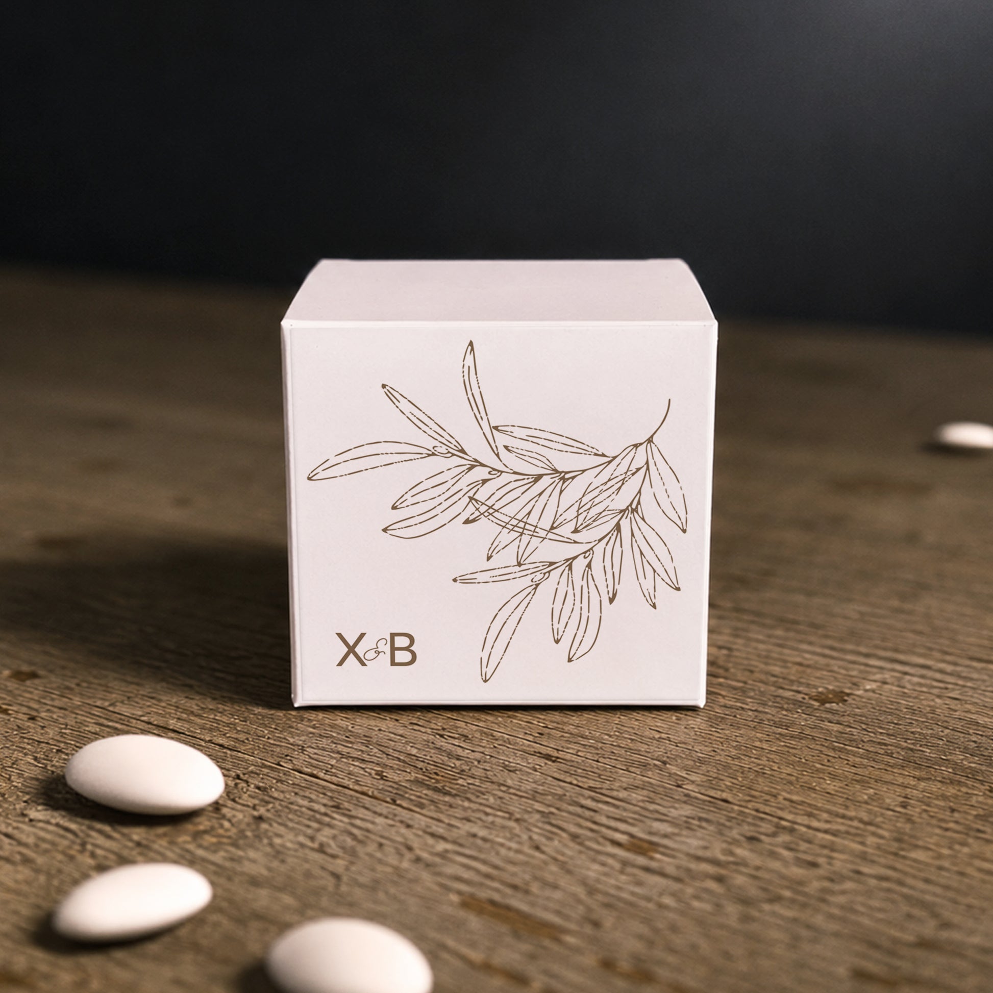 White paper cube favor box with printed sticker – elegant wedding favor box. Theme: Olive.
