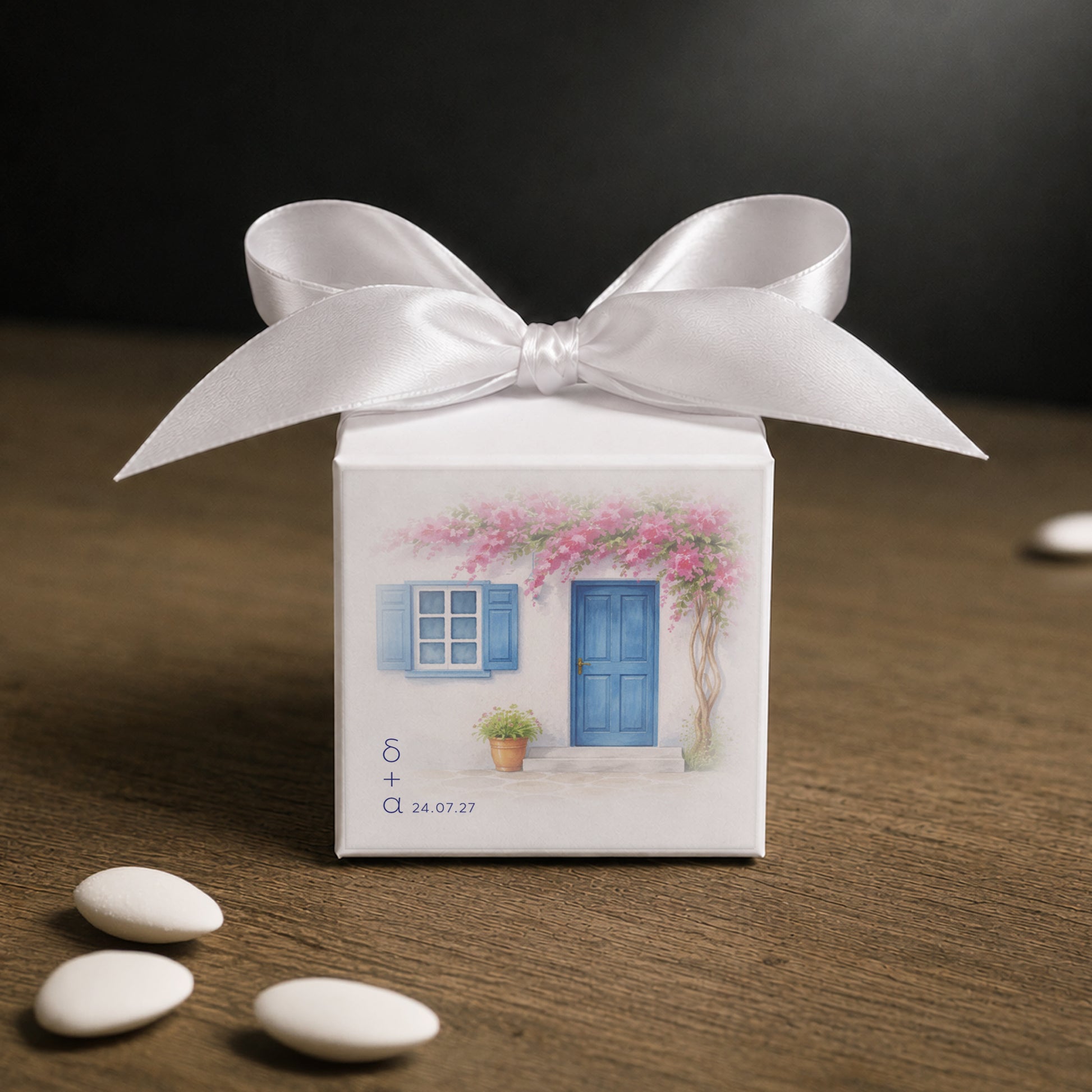 White paper cube favor box 7.5 × 7.5 × 7.5 cm, made from thick 400 gsm paper with printed sticker and ribbon in your choice of color – elegant wedding favor box. Theme: Cyclades.
