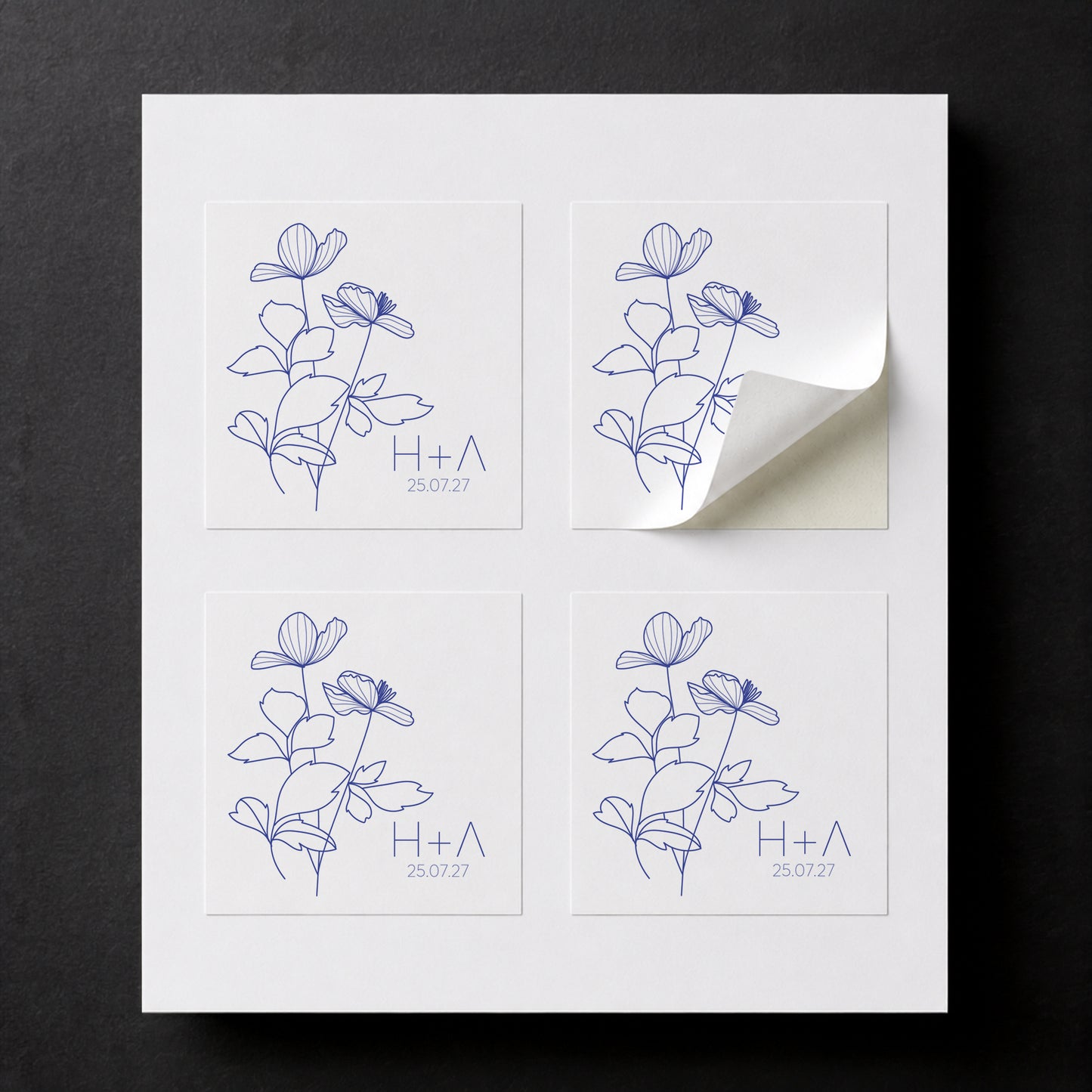 Printed Blue Anemone wedding favor stickers for white paper cube favor boxes.
