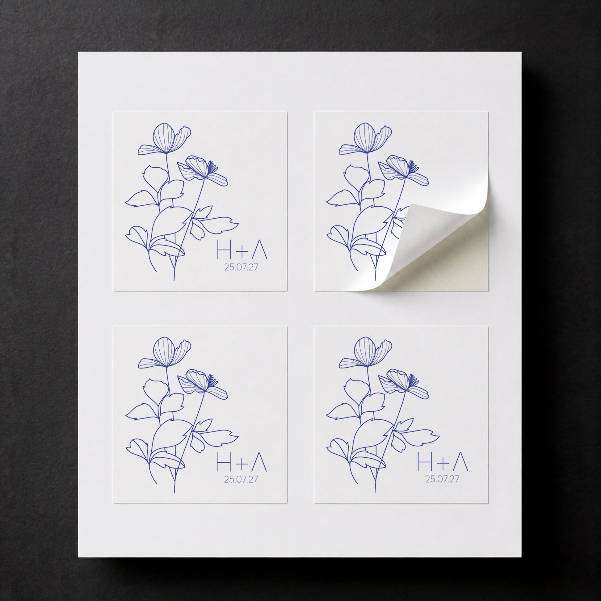 Printed Blue Anemone wedding favor stickers for white paper cube favor boxes.

