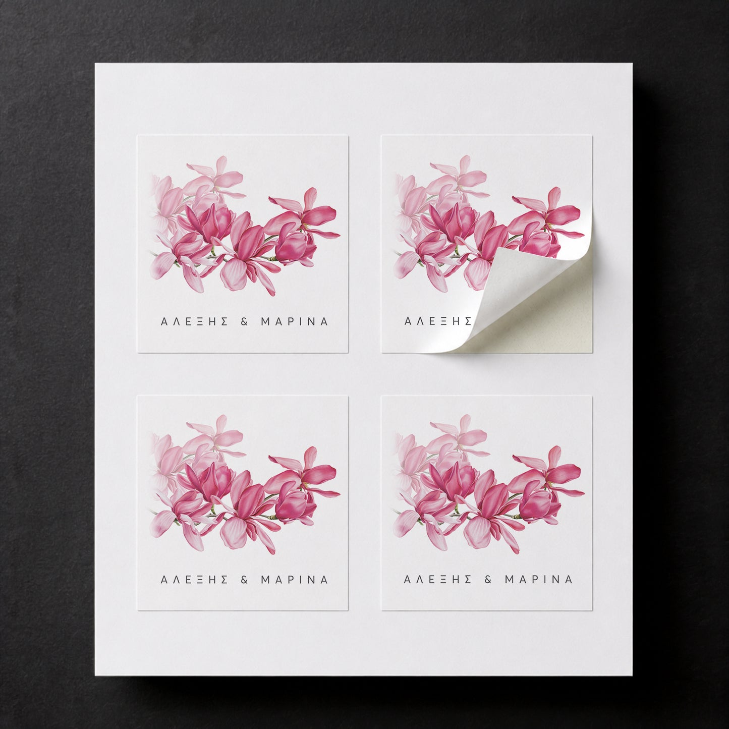 Sheet with four printed Magnolia wedding favor stickers for white paper cube favor boxes.
