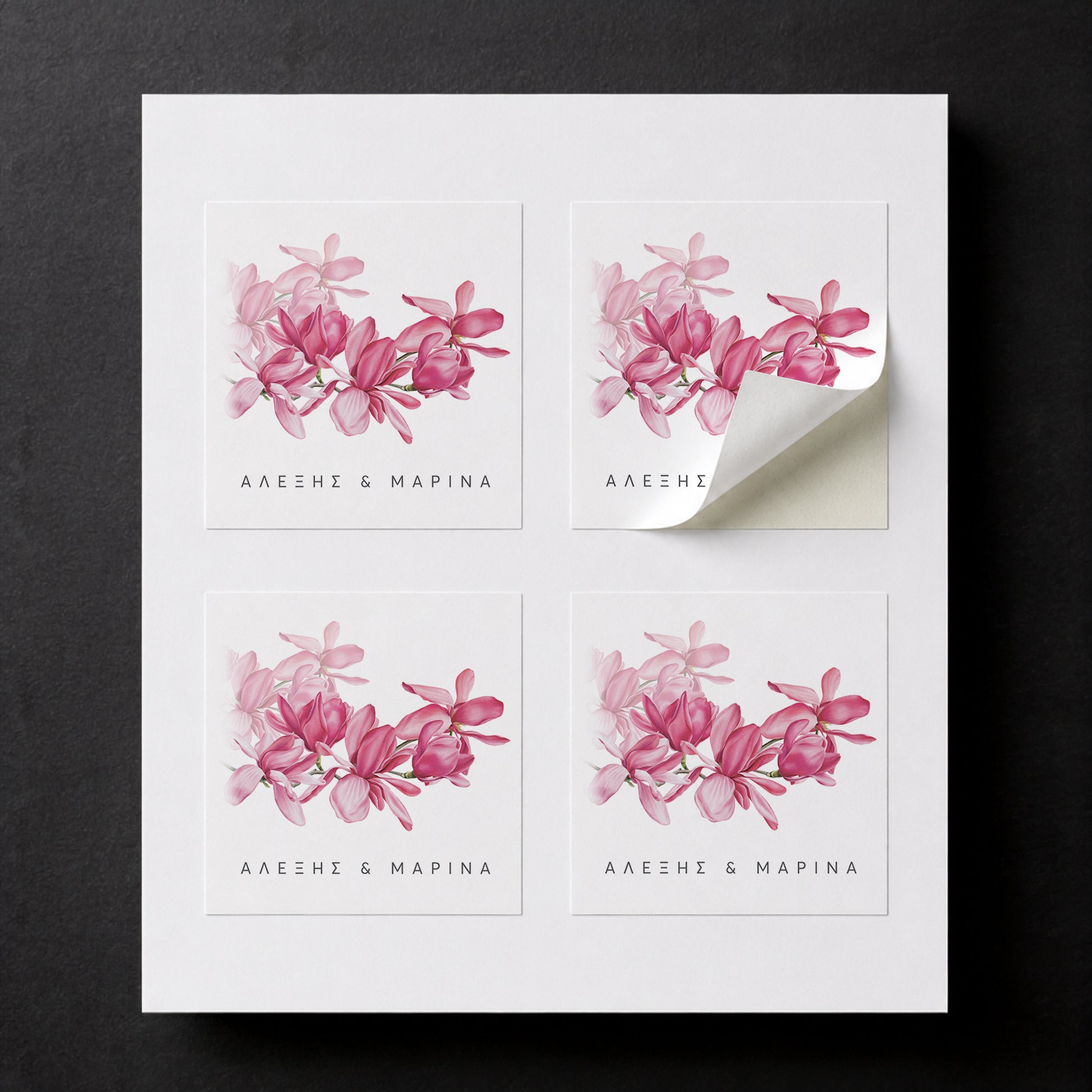 Sheet with four printed Magnolia wedding favor stickers for white paper cube favor boxes.
