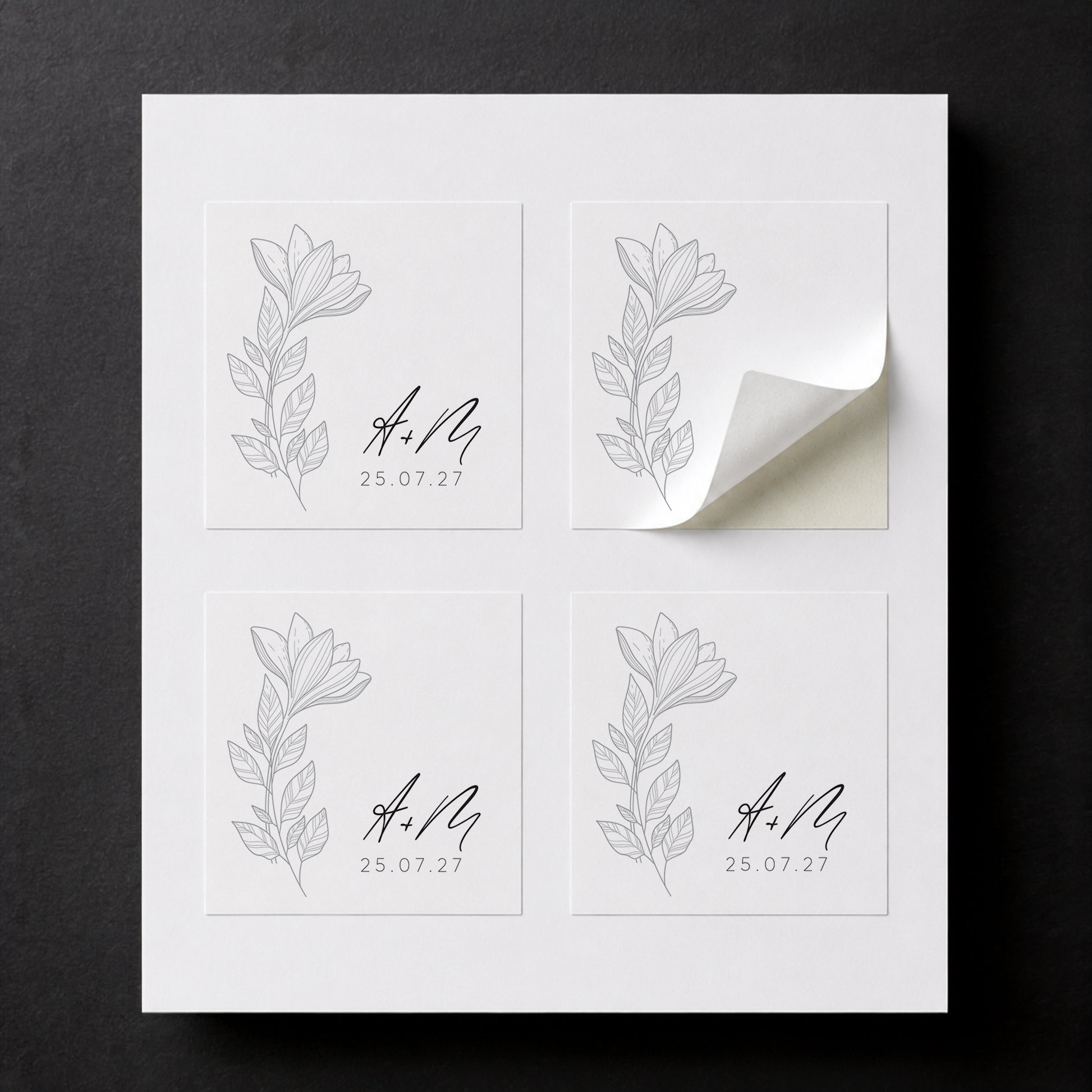 Sheet with four printed Line Black Flowers wedding favor stickers for white paper cube favor boxes.

