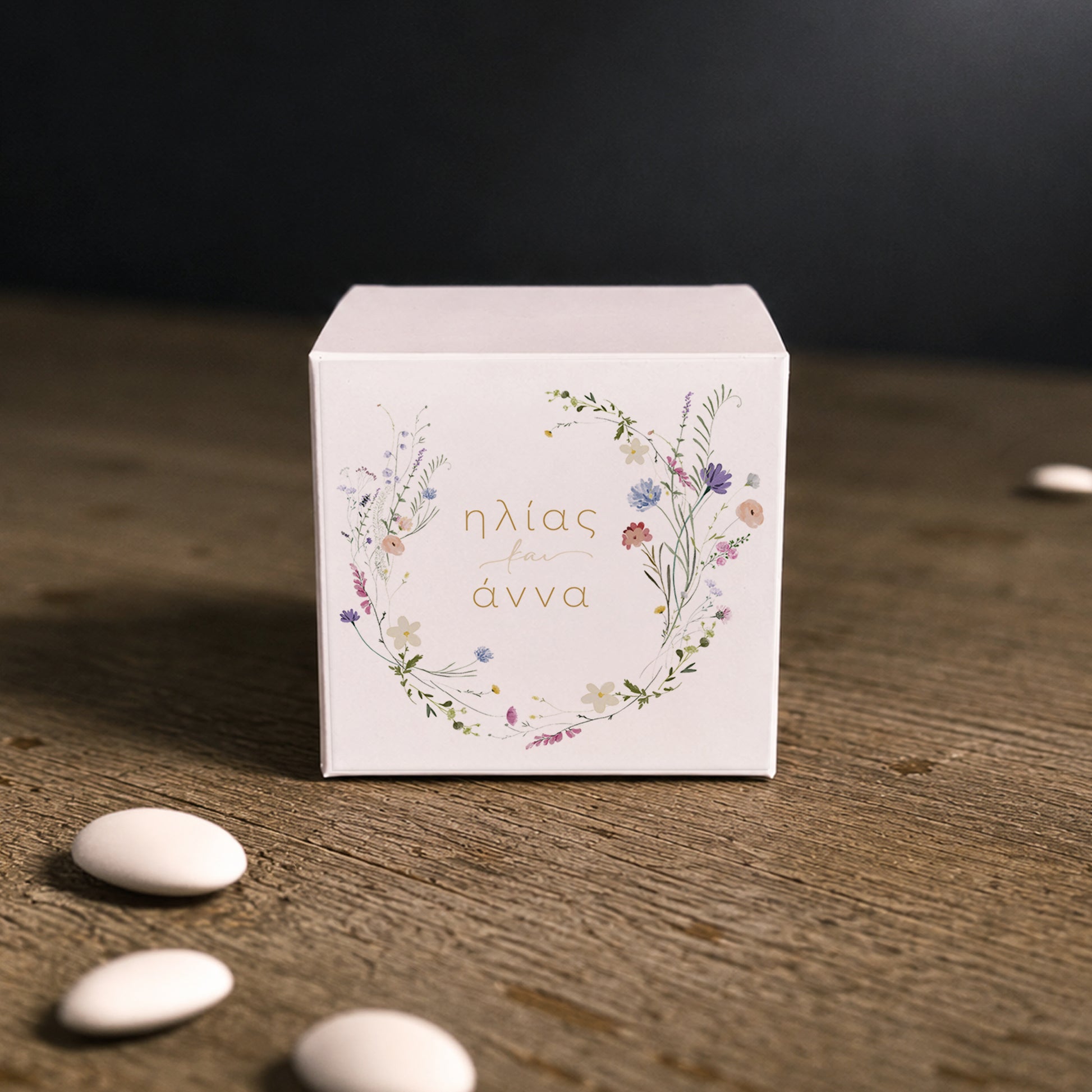 White paper cube favor box with printed sticker – elegant wedding favor box. Theme: Field Wreath.

