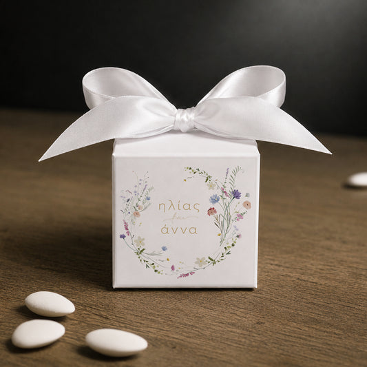 White paper cube favor box 7.5 × 7.5 × 7.5 cm, made from thick 400 gsm paper with printed sticker and ribbon in your choice of color – elegant wedding favor box. Theme: Field Wreath.
